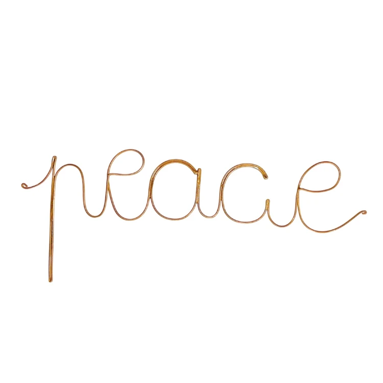 Wort aus goldenem Messingdraht "peace"