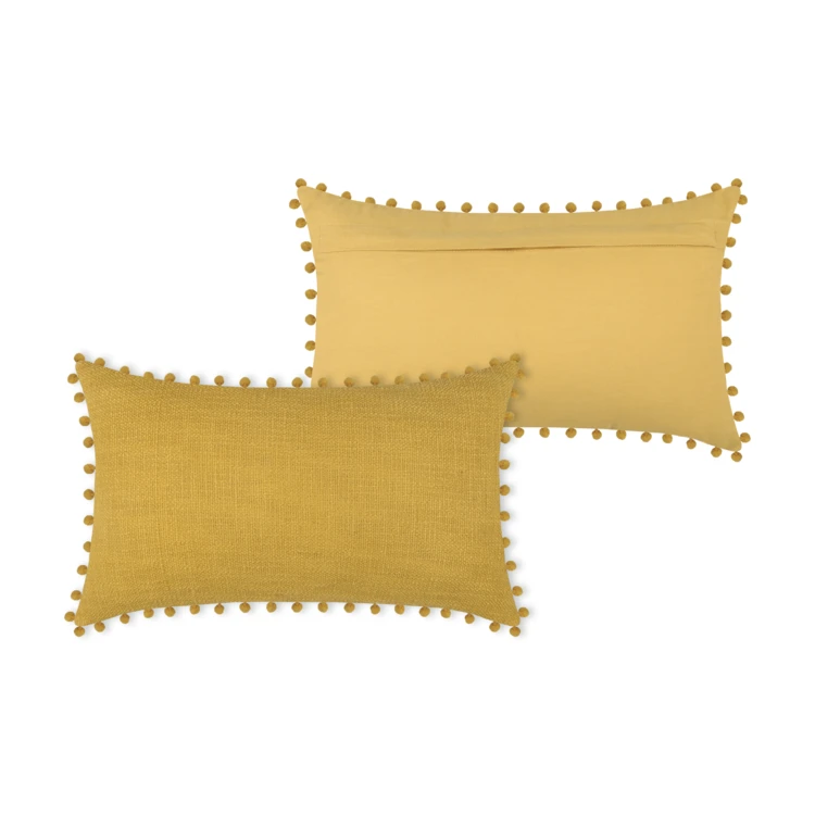 Coussin rectangulaire en coton déhoussable à pompons