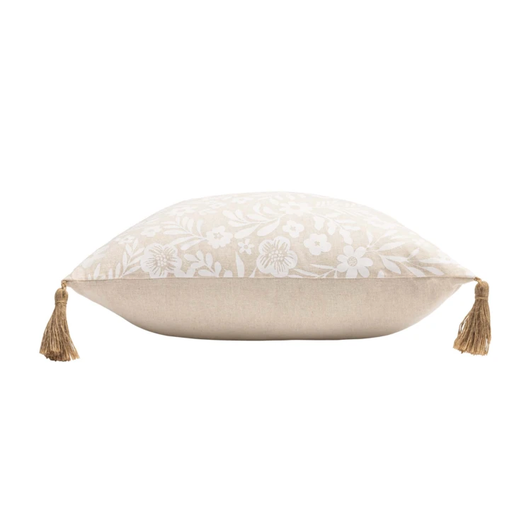 Coussin polycoton imprimé floral à pompons