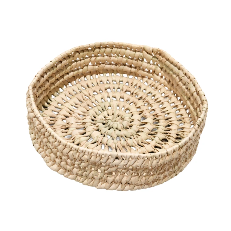 Panier rond ajouré en feuille de palmier tressé