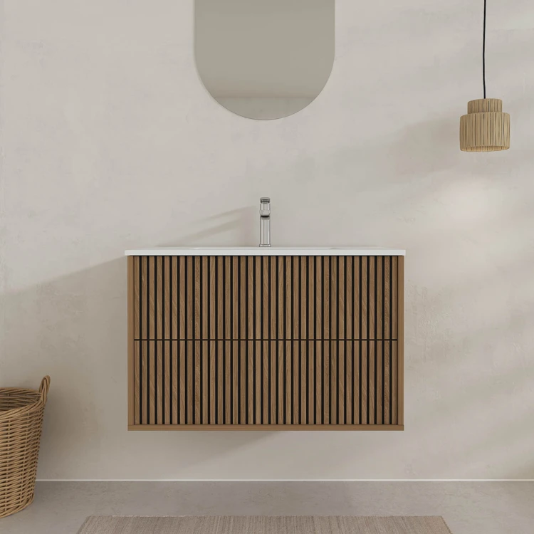 Meuble de salle de bain suspendu avec façade crantée et vasque encastrée