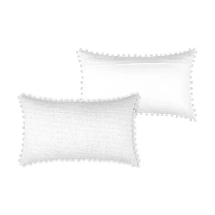 Coussin rectangulaire en coton déhoussable à pompons