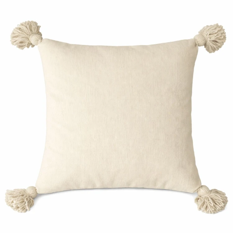 Copricuscino in lana con nappe