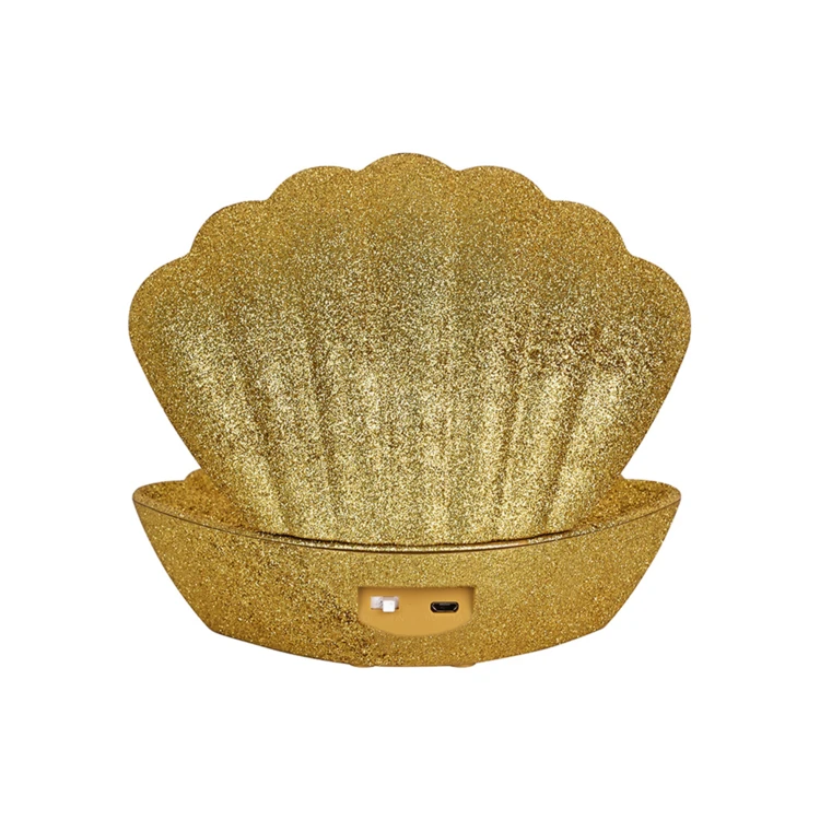 Lampada a conchiglia illuminata con effetto glitter