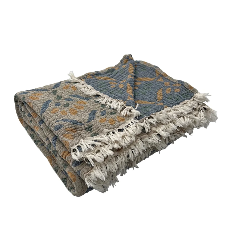 Plaid en gaze de coton lavée à motif végétal