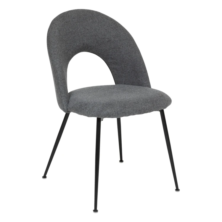 Silla de tela con respaldo calado y patas de metal