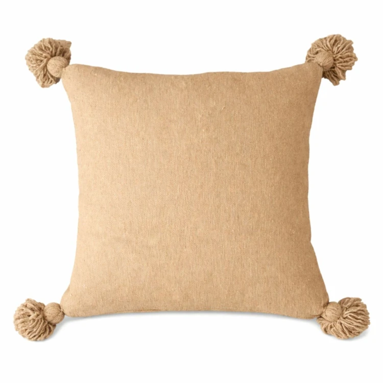 Copricuscino in lana con nappe