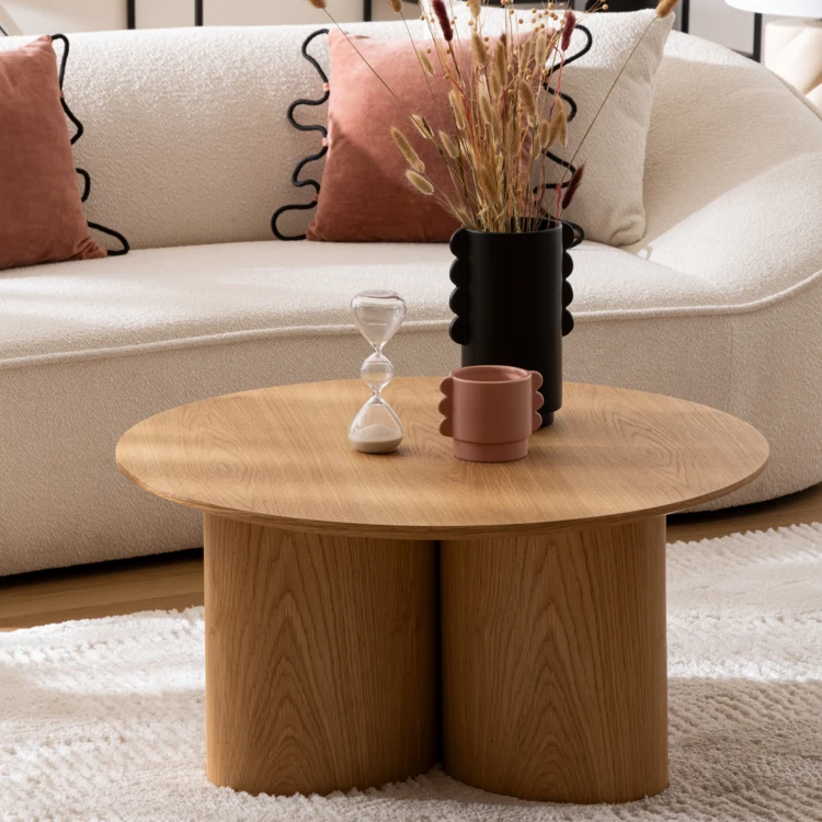 Mesa de centro redonda con aspecto de madera y base cilíndrica