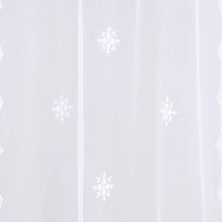 Par de cortinas blancas con motivo de copos de nieve