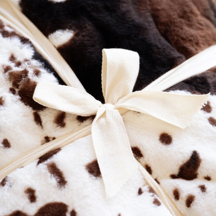 Plaid doux à motif peau de vache avec dos en velours