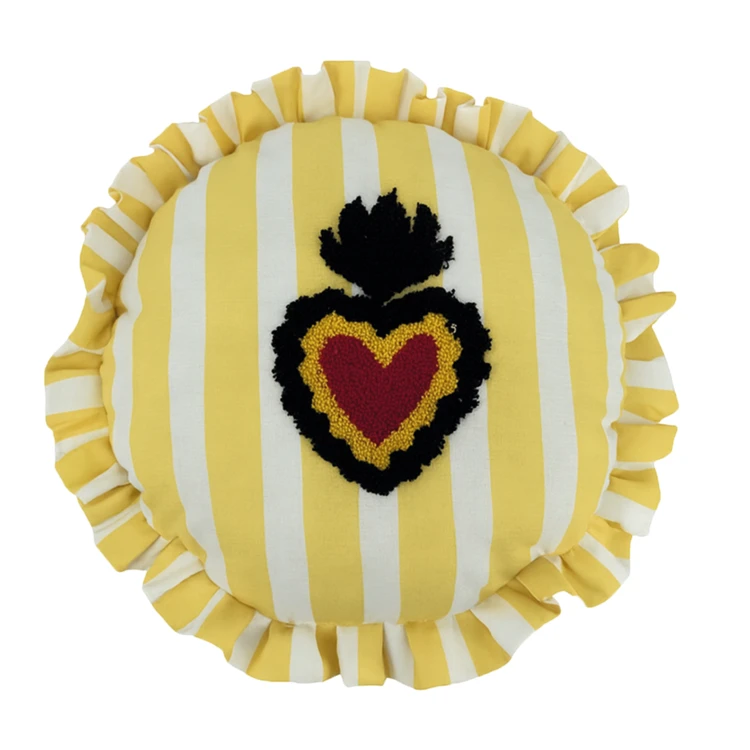 Coussin rond à rayures avec motif cœur brodé