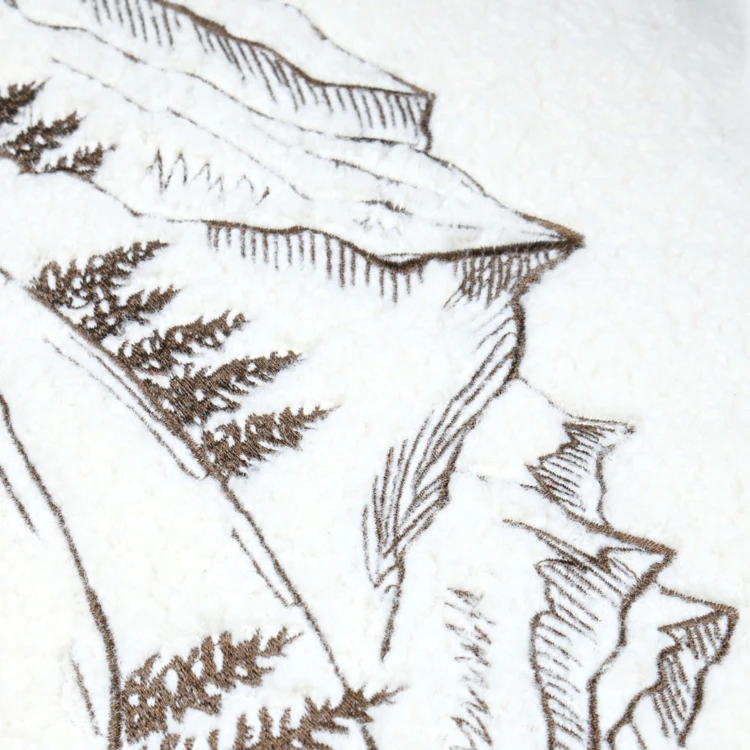 Coussin rectangulaire en bouclette à motif montagne