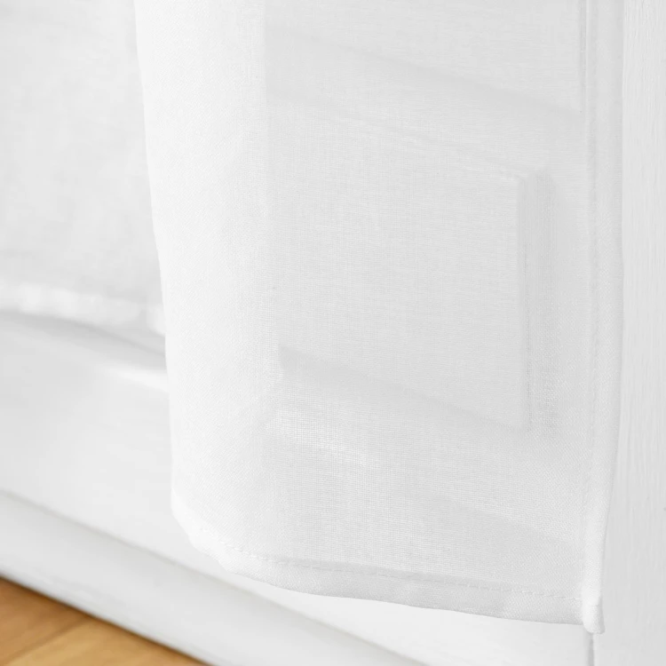 Paire de voilages passe-tringle en voile sablé avec finitions pompons