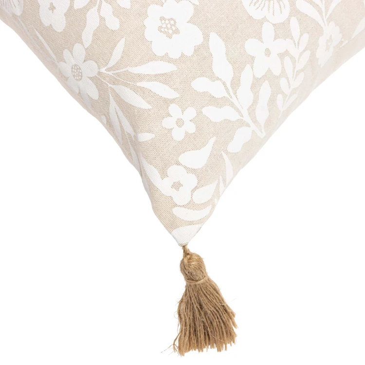 Coussin polycoton imprimé floral à pompons