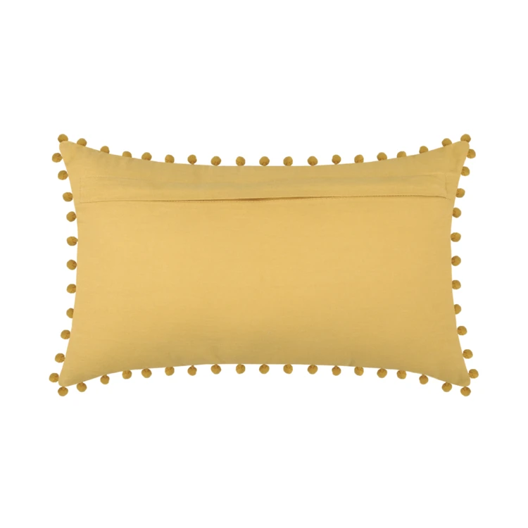 Coussin rectangulaire en coton déhoussable à pompons