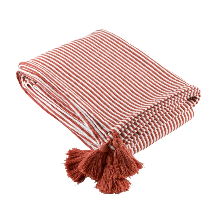 Plaid rayé à pompons