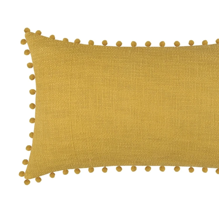 Coussin rectangulaire en coton déhoussable à pompons