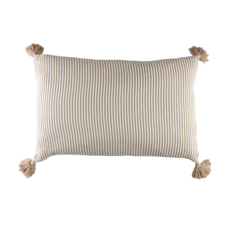 Coussin rayé à pompons