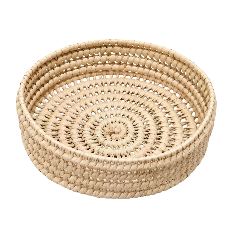 Panier rond ajouré en feuille de palmier tressé