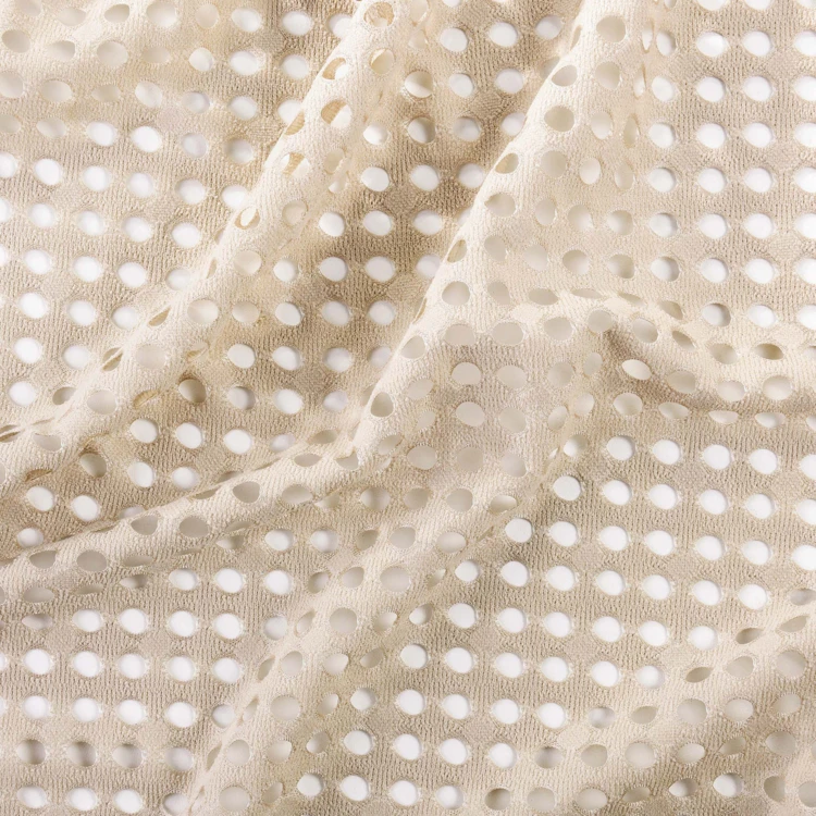 Voilage maille ajourée à oeillets