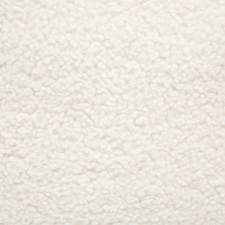 Fauteuil en bouclette au design arrondi