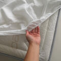 Protector de colchón en forma de sábana bajera